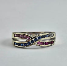 Cargar imagen en el visor de la galería, 1429: Vintage: 9ct White Gold Rubies Sapphires Crossover Ring- crisp, colourful, eye candy