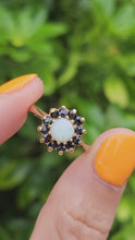 Load and play video in Gallery viewer, 2090: Vintage; 9ct Gold White Opal 12 Blue Sapphires Flower head Ring- From 1976