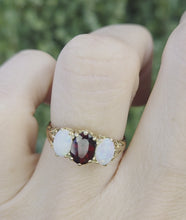 Load and play video in Gallery viewer, 2275 Vintage: 9ct Gold Cabochon White Opals Garnet 3-Stone Ring- From 1980