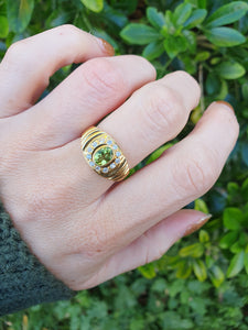 5922:  Vintage: 18ct gold Green Peridot White Sapphires Dress Ring- lovely stones, statement weight