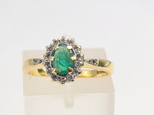 7007:Vintage: 18ct Gold Oval Emerald 14 Brilliant Cut Diamonds Cluster Ring- lovely quality, hallmarked in London