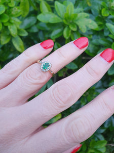 7007:Vintage: 18ct Gold Oval Emerald 14 Brilliant Cut Diamonds Cluster Ring- lovely quality, hallmarked in London