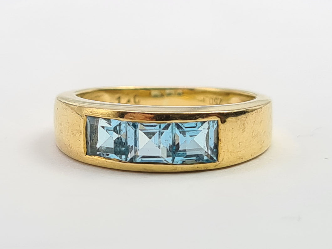 7125: Vintage: 18ct Gold Channel Set Swiss Blue Topaz Ring- lovely cut and colours