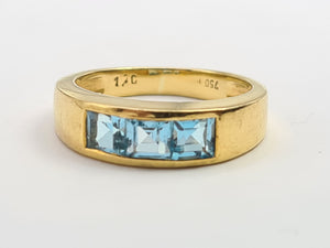 7125: Vintage: 18ct Gold Channel Set Swiss Blue Topaz Ring- lovely cut and colours