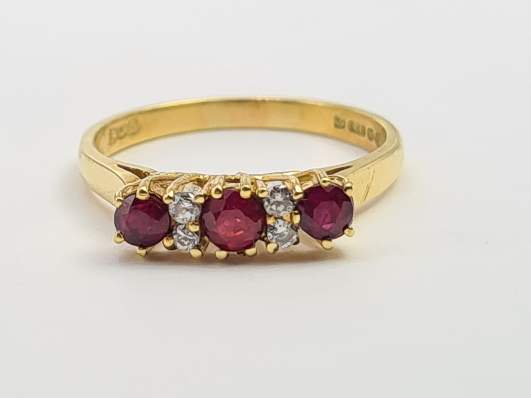 7281: Vintage(1977): 18ct Gold Rubies Diamonds Dress Ring- very fine example, blood red rubies,