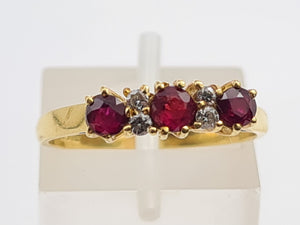 7281: Vintage(1977): 18ct Gold Rubies Diamonds Dress Ring- very fine example, blood red rubies,