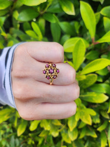 7476: Vintage; 18ct Gold 7 Rubies Floral Cluster Cocktail Ring- geometric set