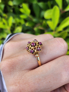 7476: Vintage; 18ct Gold 7 Rubies Floral Cluster Cocktail Ring- geometric set