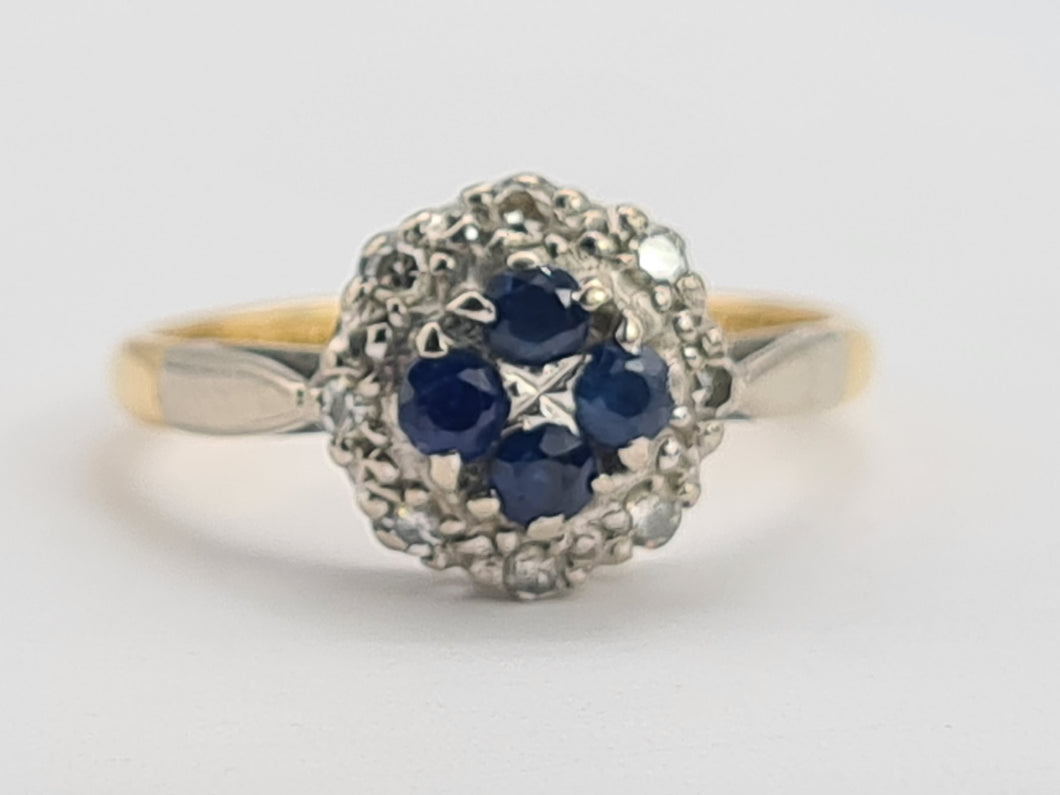 8089: Vintage: (1965)- 18ct Gold Blue Sapphires 8 Round Cut Diamonds Cluster Ring- petite, sparkling, geometric set