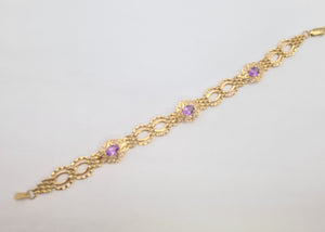 0089: Vintage 9ct Gold Bracelet with oval cut lilac  amethysts in excellent condition.