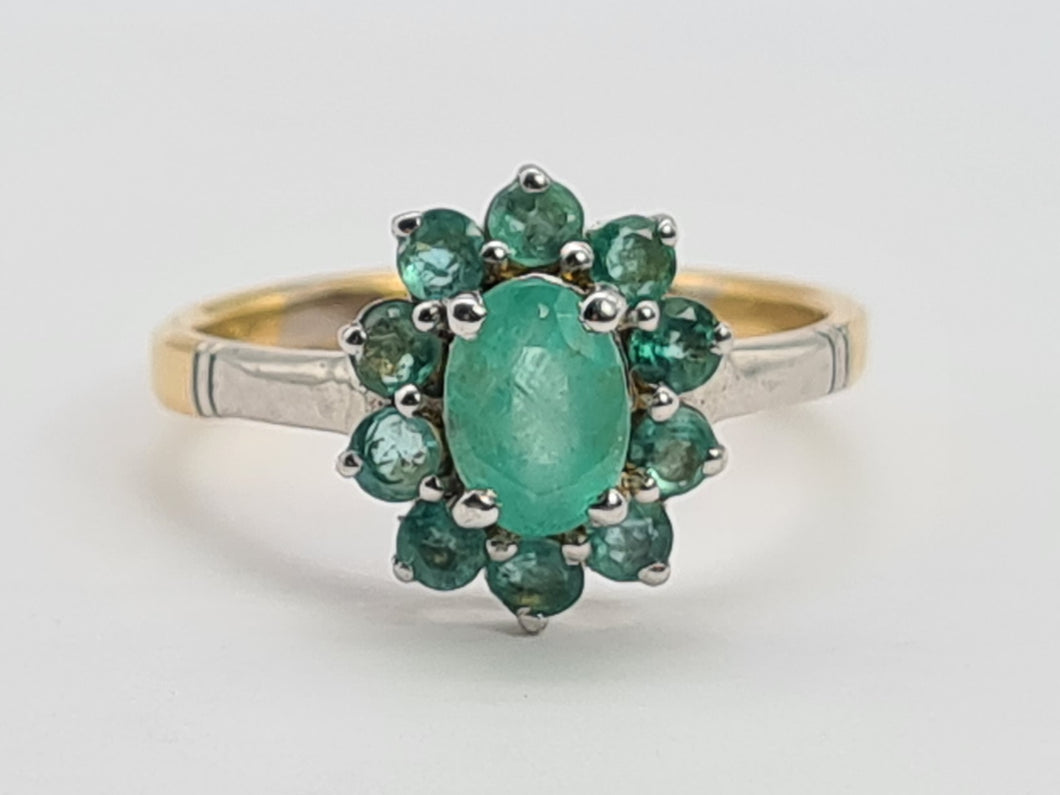 0651: Vintage: 18ct Gold Emeralds Flower Head Ring- white gold detail on shoulders