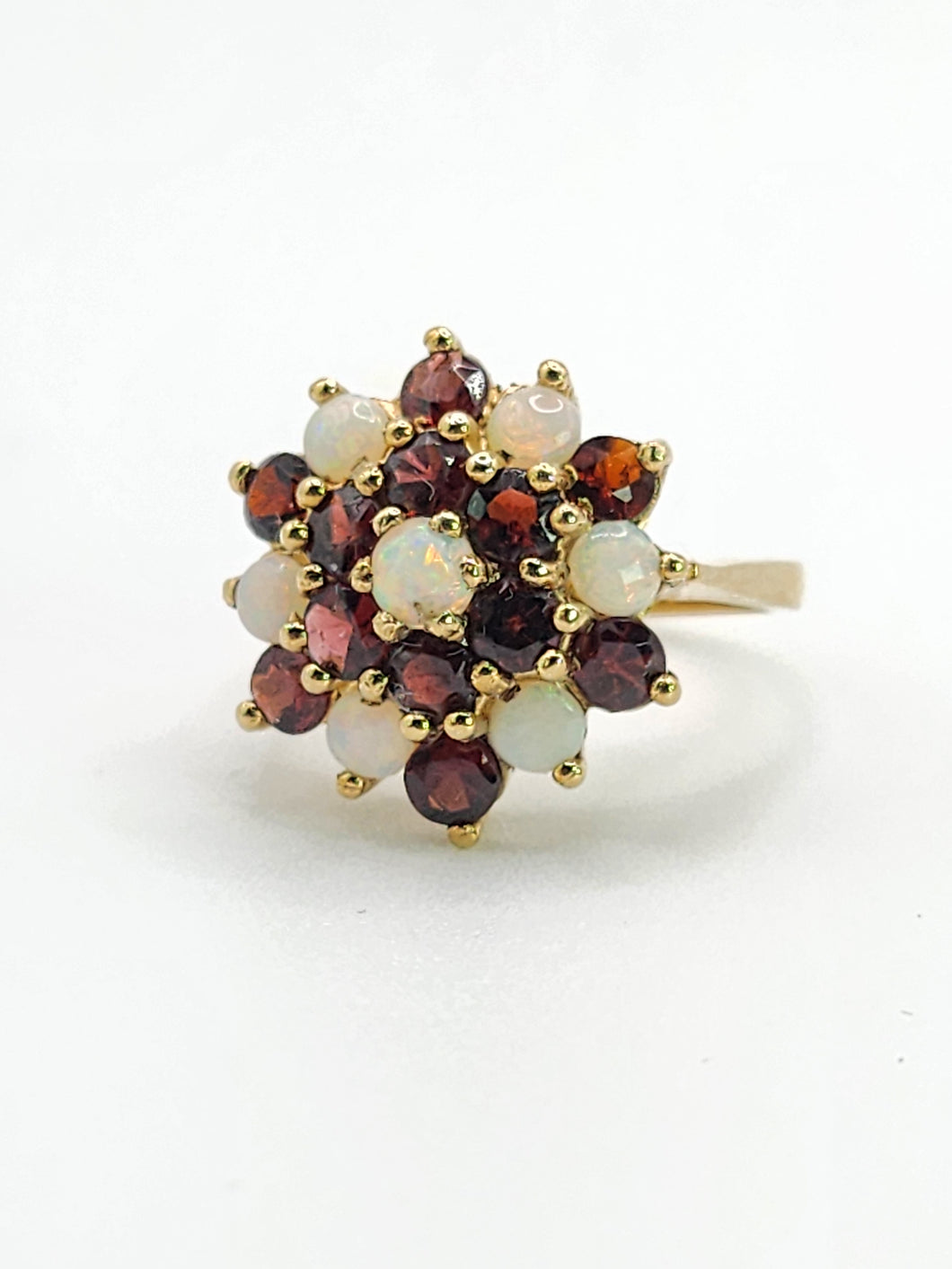 1596: Vintage:  9ct Gold White Opals Red Garnets Flowerhead Cluster Ring- From 1972