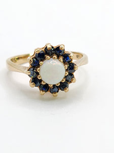 2090: Vintage; 9ct Gold White Opal 12 Blue Sapphires Flower head Ring- From 1976