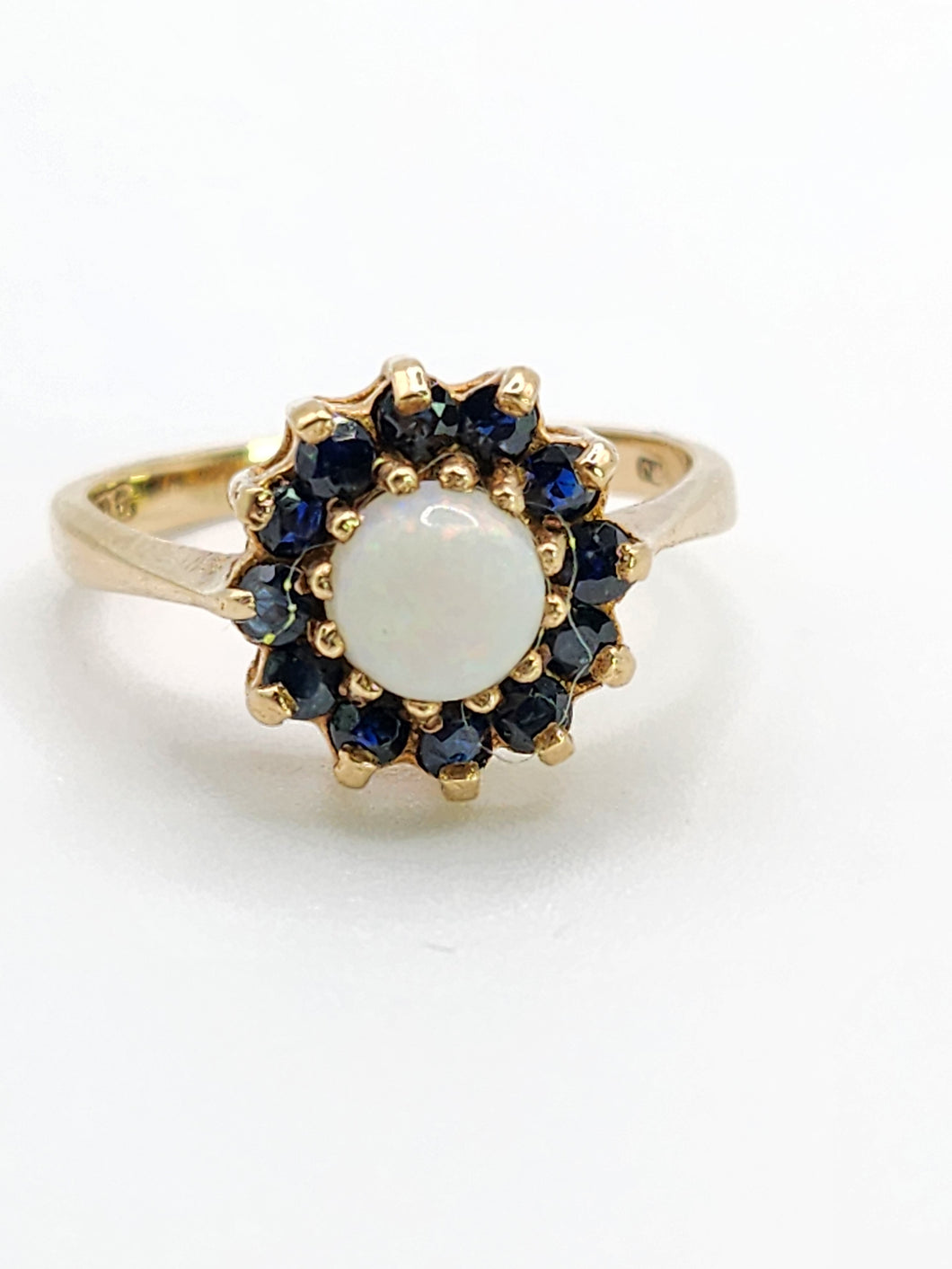 2090: Vintage; 9ct Gold White Opal 12 Blue Sapphires Flower head Ring- From 1976