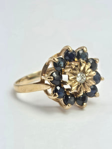 2121: Vintage: 9ct Gold Diamond Blue Sapphires Diamonds Flower Head Ring- from 1980