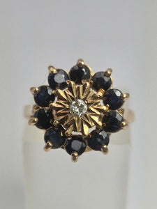 2121: Vintage: 9ct Gold Diamond Blue Sapphires Diamonds Flower Head Ring- from 1980