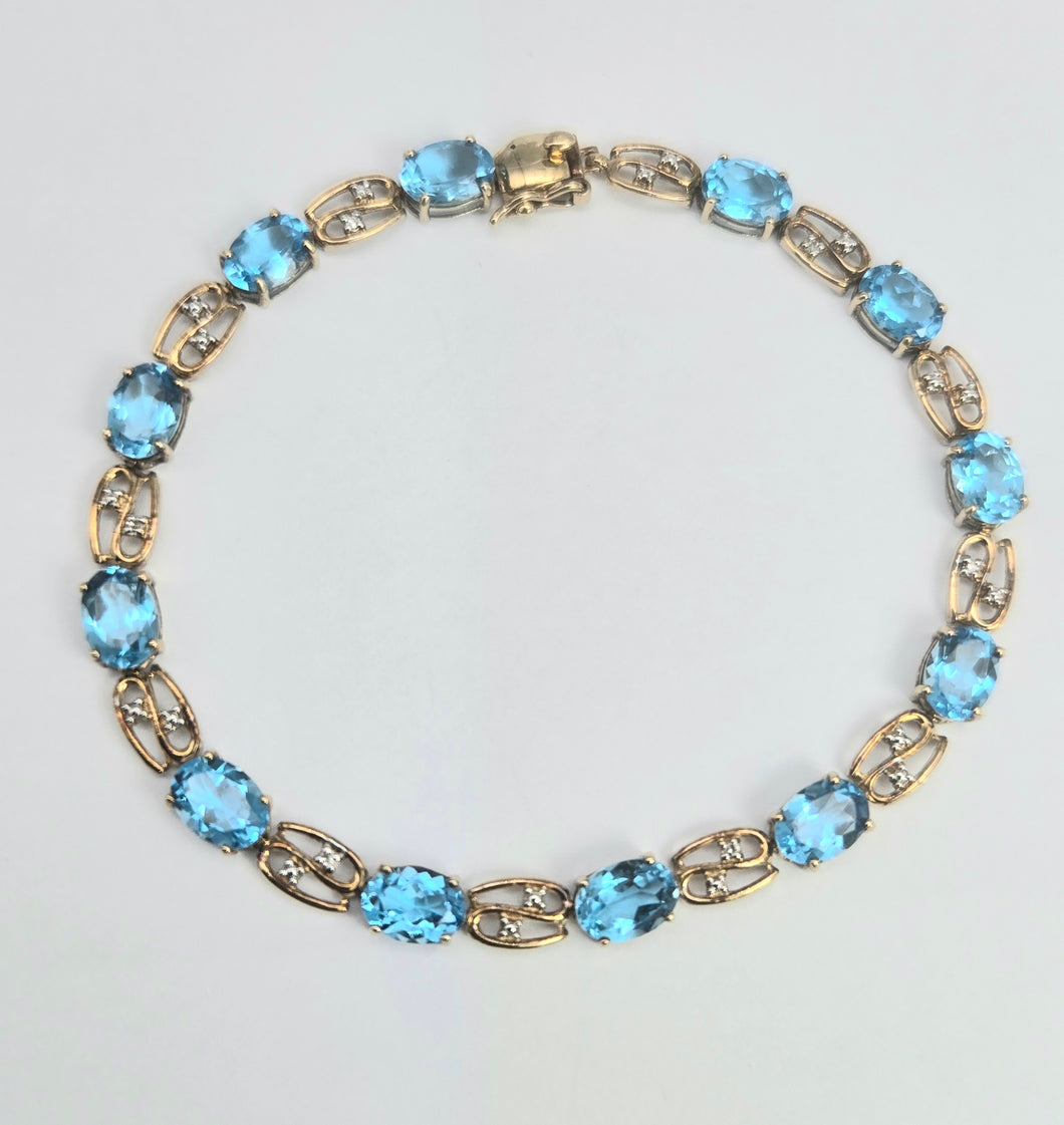 2110: Vintage; 9ct Gold Swiss Blue Topaz Natural Diamonds Bracelet (18.5cm)