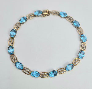 2110: Vintage; 9ct Gold Swiss Blue Topaz Natural Diamonds Bracelet (18.5cm)