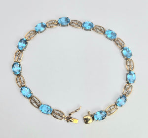 2110: Vintage; 9ct Gold Swiss Blue Topaz Natural Diamonds Bracelet (18.5cm)