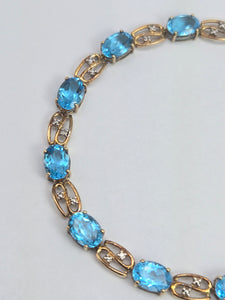 2110: Vintage; 9ct Gold Swiss Blue Topaz Natural Diamonds Bracelet (18.5cm)
