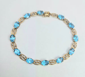 2110: Vintage; 9ct Gold Swiss Blue Topaz Natural Diamonds Bracelet (18.5cm)