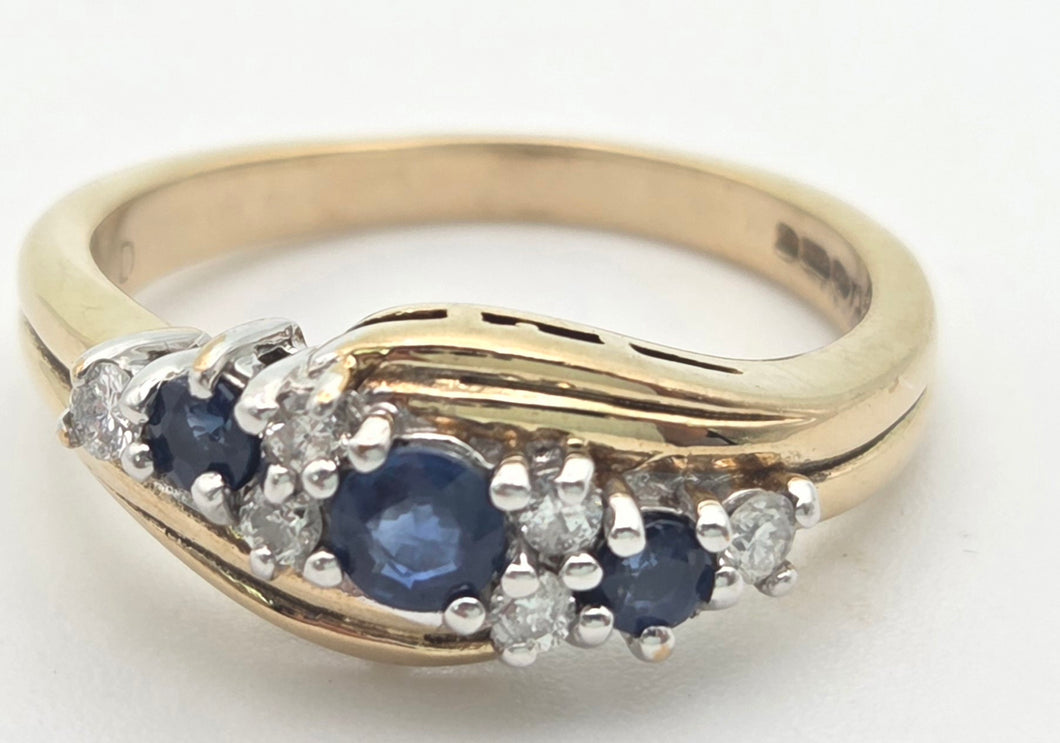 2249 Vintage: 9ct Gold Cornflower Blue Sapphires Natural Diamonds Crossover Ring