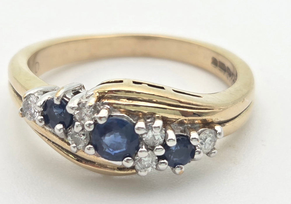 2249 Vintage: 9ct Gold Cornflower Blue Sapphires Natural Diamonds Crossover Ring