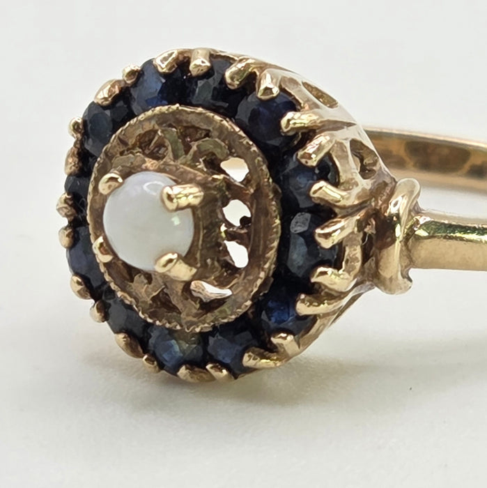 2858: Vintage 9ct Gold White Opal 12 Blue Sapphires Openwork Ring- From 1971