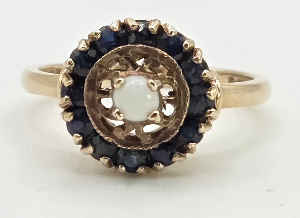 2858: Vintage 9ct Gold White Opal 12 Blue Sapphires Openwork Ring- From 1971