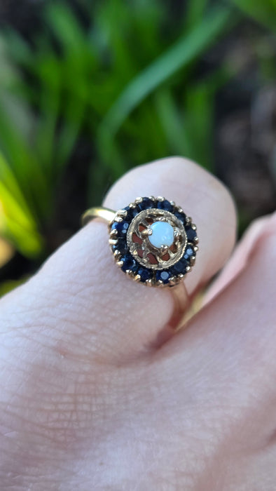 2858: Vintage 9ct Gold White Opal 12 Blue Sapphires Openwork Ring- From 1971