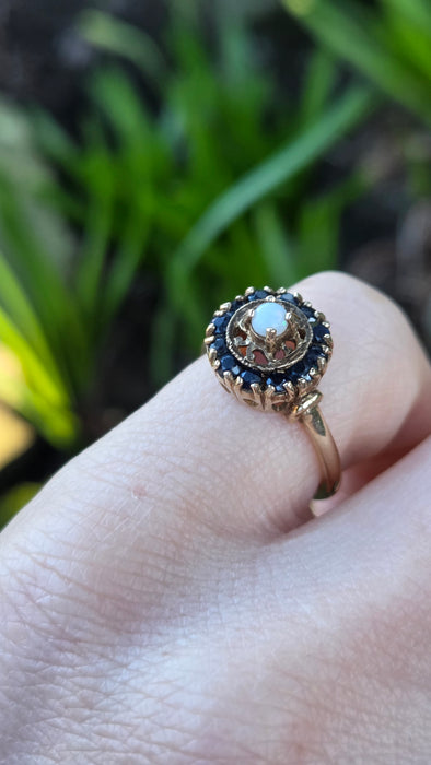 2858: Vintage 9ct Gold White Opal 12 Blue Sapphires Openwork Ring- From 1971