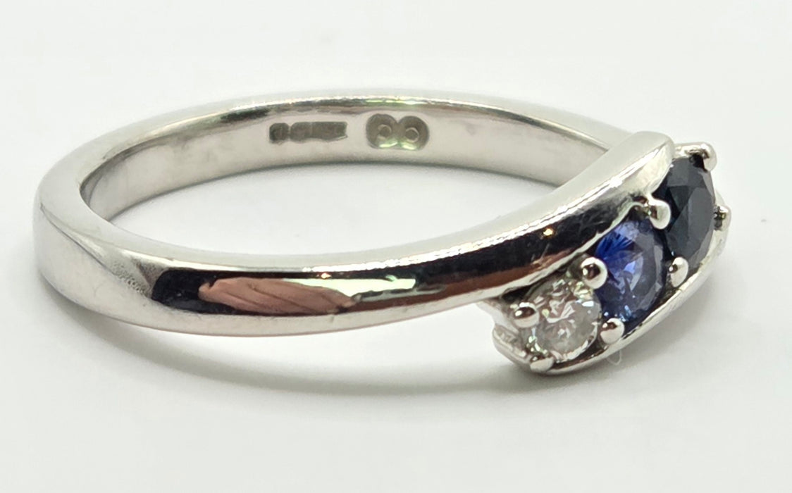 3165 Vintage: Platinum Blue Sapphire & Diamond Three-Stone Crossover Ring