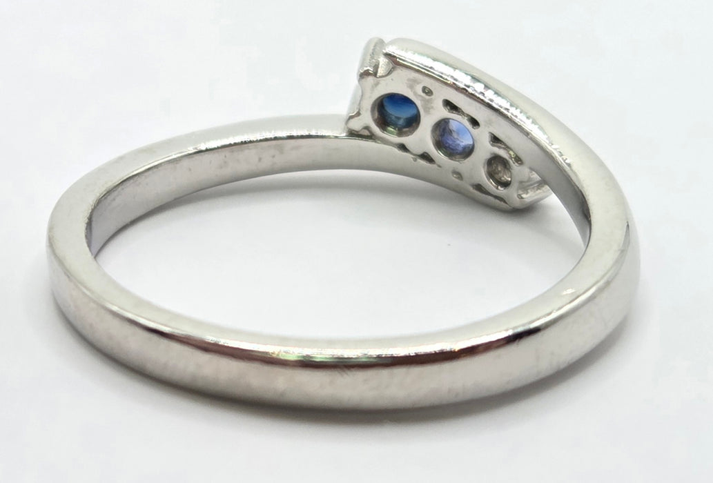 3165 Vintage: Platinum Blue Sapphire & Diamond Three-Stone Crossover Ring