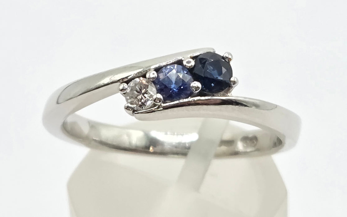 3165 Vintage: Platinum Blue Sapphire & Diamond Three-Stone Crossover Ring