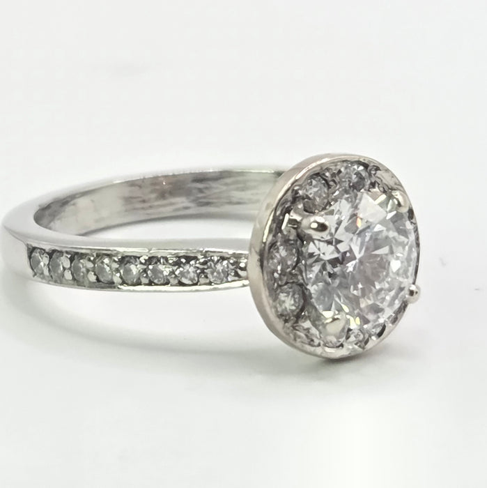 Modern: Platinum Diamond Solitaire (0.70ct) & Halo Cluster Ring — 1.59ct