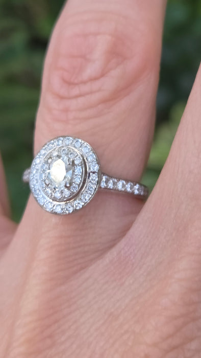 Vintage: 18ct White Gold Diamond 0.70ct Oval Halo Cluster Ring by Jenny Packham