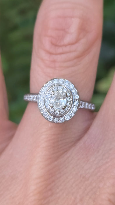 Vintage: 18ct White Gold Diamond 0.70ct Oval Halo Cluster Ring by Jenny Packham