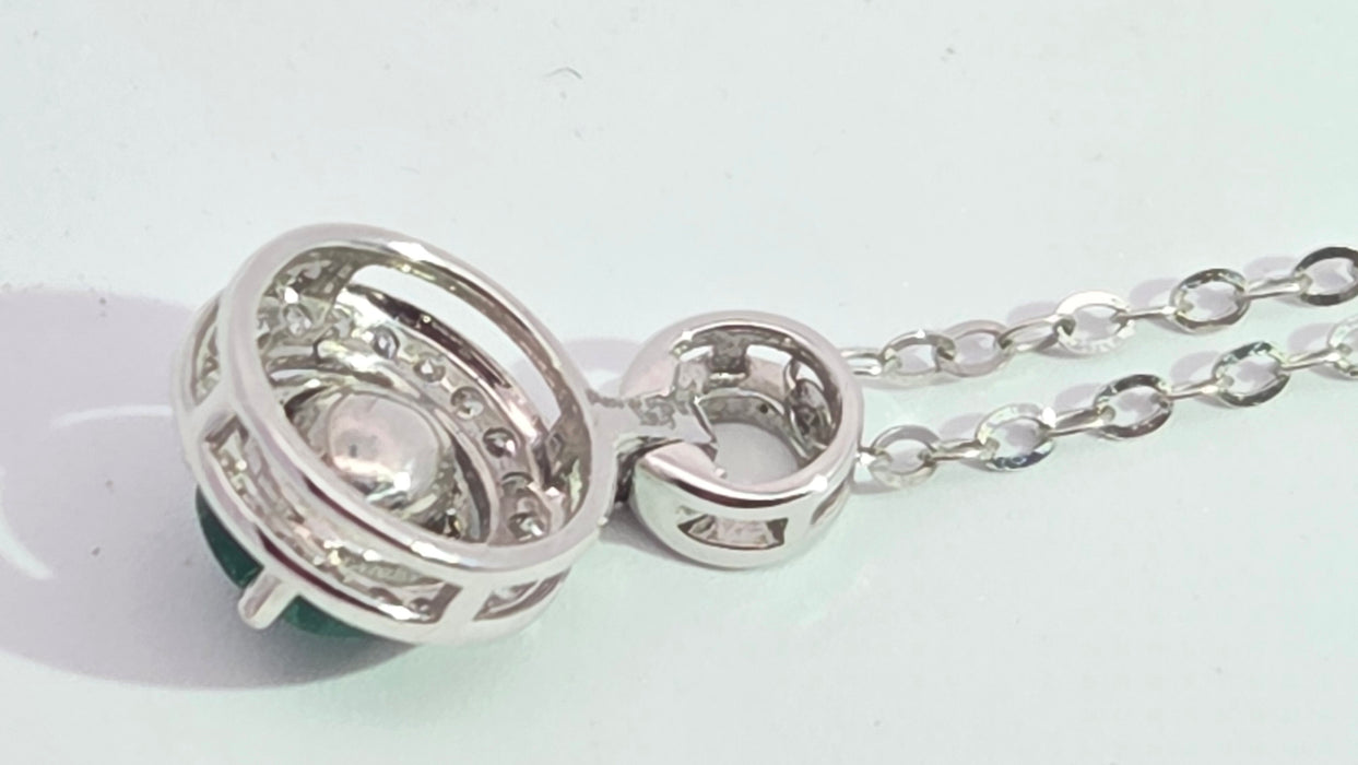 Vintage: 18ct White Gold Emerald 0.55ct & Diamond 0.06ct Halo Pendant and Chain