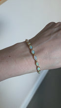 Load and play video in Gallery viewer, 2724: Vintage 14ct Gold 19 Cabochon White Opals Bracelet (19cm)
