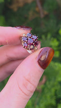 Load and play video in Gallery viewer, 2129 Vintage; 9ct Gold 7 Rich Red Round Cut Garnets Flower Head Ring
