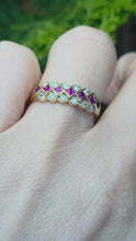 Load and play video in Gallery viewer, 0954: Vintage 18ct three row ruby and diamond half hoop ring
