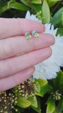 Load and play video in Gallery viewer, 7269:Vintage Rare: Platinum Peridot Stud Earrings- crisp platinum showcasing gorgeous green peridots
