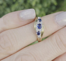Load and play video in Gallery viewer, 2249 Vintage: 9ct Gold Cornflower Blue Sapphires Natural Diamonds Crossover Ring
