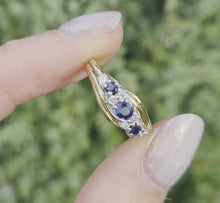 Load and play video in Gallery viewer, 2249 Vintage: 9ct Gold Cornflower Blue Sapphires Natural Diamonds Crossover Ring
