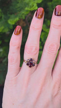 Load and play video in Gallery viewer, 2129 Vintage; 9ct Gold 7 Rich Red Round Cut Garnets Flower Head Ring
