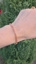 Load and play video in Gallery viewer, 2319: Vintage:: 18ct Gold Padparadscha 39&nbsp; Orange Sapphires (8.19ct) Tennis Bracelet- Exquisite
