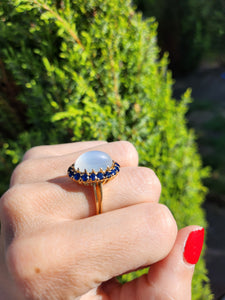 1725: Vintage:18ct Gold Large Moonstone (7ct) 18 Blue Sapphires Cocktail Ring- sensational