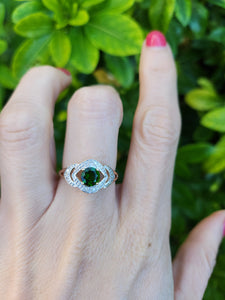 A8344: Vintage: Eye catching 9ct Gold Green Diopside 12 diamonds Halo Dress ring