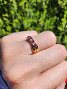1380: Vintage: 9ct Gold Rubies Diamonds Crossover Ring- sparkling symmetry