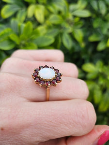 0775: Vintage: 9ct Gold White Opal Red Garnets Flower- Head Cocktail Ring- Date-Mark 1977